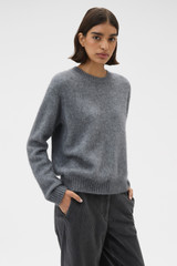 Profile view of model wearing the Oroton Cashmere Blend Knit in Grey Marle and 70% ultra-fine merino wool and 30% cashmere blend fabric for Women .