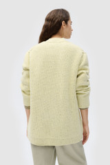 Profile view of model wearing the Oroton Oversized Manstyle Cardigan in Sorbet and 80% wool and 20% nylon fabric for Women .