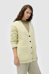 Profile view of model wearing the Oroton Oversized Manstyle Cardigan in Sorbet and 80% wool and 20% nylon fabric for Women .