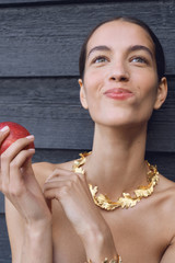 Profile view of model wearing the Oroton Oak Necklace in Worn Gold and Premium brass material for Women .