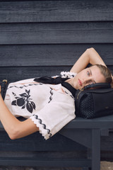 Profile view of model wearing the Oroton Stencil Print Camp Shirt in Soft Peach and 100%  linen fabric for Women .