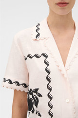 Profile view of model wearing the Oroton Stencil Print Camp Shirt in Soft Peach and 100%  linen fabric for Women .