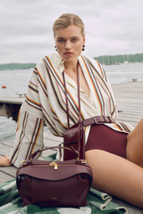 Profile view of model wearing the Oroton Fiesta Stripe Robe in Multi and 100% heavyweight linen fabric for Women .