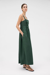 Profile view of model wearing the Oroton Handkerchief Sundress in Ivy and 100% mid-weight linen fabric with a lightly textured surface for Women . IP:3