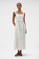 Profile view of model wearing the Oroton Handkerchief Sundress in Antique White and 100% mid-weight linen fabric with a lightly textured surface for Women .