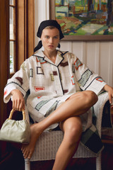 Profile view of model wearing the Oroton Vintage Label Print Tunic Dress in Cream and 100%  linen fabric for Women . IP:6
