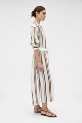 Profile view of model wearing the Oroton Fiesta Stripe Column Dress in Multi and 100%  linen fabric for Women .