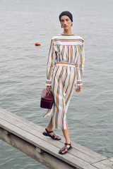 Profile view of model wearing the Oroton Fiesta Stripe Column Dress in Multi and 100%  linen fabric for Women . IP:6