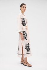 Profile view of model wearing the Oroton Stencil Print Long Tunic Dress in Soft Peach and 100%  linen fabric for Women . IP:4