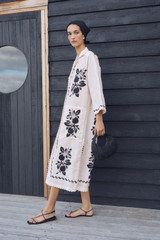 Profile view of model wearing the Oroton Stencil Print Long Tunic Dress in Soft Peach and 100%  linen fabric for Women . IP:6
