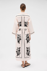 Profile view of model wearing the Oroton Stencil Print Long Tunic Dress in Soft Peach and 100%  linen fabric for Women .