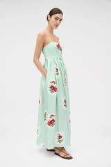 Profile view of model wearing the Oroton Folk Doilie Print Sun Dress in Mint and 100% silk fabric for Women .