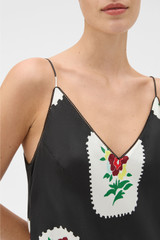 Profile view of model wearing the Oroton Folk Doilie Print Slip Dress in Black and 100% silk fabric for Women .