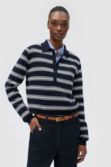 Profile view of model wearing the Oroton FLORA FINE KNIT STRIPE POLO in North Sea and 55% extra fine merino wool and 45% cotton blend fabric for Women .