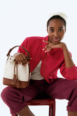 Profile view of model wearing the Oroton MAGGIE BUCKET CANVAS BROGUING in NATURAL/PENNY BROWN and Premium canvas material for Women .