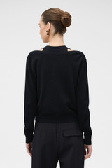 Profile view of model wearing the Oroton V-Detail Cardigan in BLACK and 100% fine gauge merino wool fabric for Women .