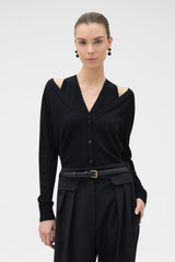 Profile view of model wearing the Oroton V-Detail Cardigan in BLACK and 100% fine gauge merino wool fabric for Women .
