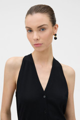 Profile view of model wearing the Oroton Fine Gauge Knit Waistcoat in BLACK and 100% fine gauge merino wool fabric for Women .