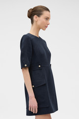 Profile view of model wearing the Oroton Button Detail Dress in NORTH SEA and 100% bonded heavy linen fabric for Women . IP:3