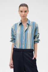 Profile view of model wearing the Oroton MARINE STRIPE FRENCH CUFF in SAILOR BLUE and 100% cotton shirting for Women .