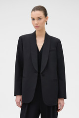 Profile view of model wearing the Oroton Dinner Jacket in BLACK and 53% polyester, 43% wool, and 4% lycra Italian wool blend for Women .