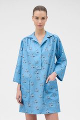 Profile view of model wearing the Oroton Marine Yacht Tunic Dress in SAILOR BLUE and 100% midweight linen fabric for Women .