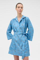 Profile view of model wearing the Oroton Marine Yacht Tunic Dress in SAILOR BLUE and 100% midweight linen fabric for Women .