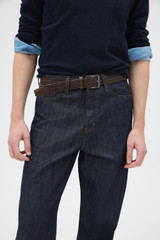 Profile view of model wearing the Oroton Jessie Woven Belt in CHOCOLATE and Premium woven bonded leather for Men .