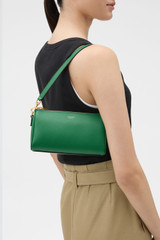 Profile view of model wearing the Oroton Harvey Baguette Crossbody in CROCODILE and Premium smooth leather for Women . IP:2