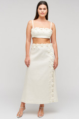 Profile view of model wearing the Oroton Rosebud Lace Skirt in Soft Cream and 100% linen material for Women .