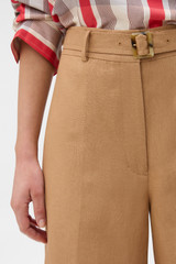 Profile view of model wearing the Oroton Belt Detail Culotte in CAMEL and 100% heavyweight linen fabric for Women .
