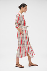 Profile view of model wearing the Oroton Shadow Check Shirt Dress in MARKET RED and 100% silk dupion fabric for Women .