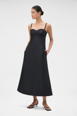 Profile view of model wearing the Oroton Sculptured Bodice Dress in BLACK and 85% polyester and 15% silk blend fabric for Women .