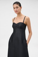 Profile view of model wearing the Oroton Sculptured Bodice Dress in BLACK and 85% polyester and 15% silk blend fabric for Women .