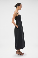 Profile view of model wearing the Oroton Sculptured Bodice Dress in BLACK and 85% polyester and 15% silk blend fabric for Women .