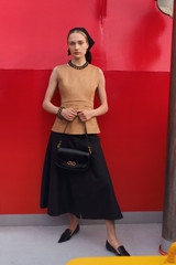 Profile view of model wearing the Oroton Belted Shell in CAMEL and 100% heavyweight linen fabric for Women . IP:7