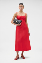 Profile view of model wearing the Oroton Sculptured Bodice Dress in POPPY and 85% polyester and 15% silk blend fabric for Women .
