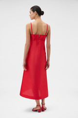 Profile view of model wearing the Oroton Sculptured Bodice Dress in POPPY and 85% polyester and 15% silk blend fabric for Women .