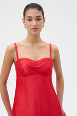 Profile view of model wearing the Oroton Sculptured Bodice Dress in POPPY and 85% polyester and 15% silk blend fabric for Women .