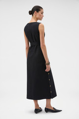 Profile view of model wearing the Oroton Button Detail Dress in BLACK and 100% heavyweight linen fabric for Women .
