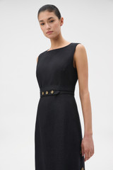 Profile view of model wearing the Oroton Button Detail Dress in BLACK and 100% heavyweight linen fabric for Women .