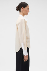 Profile view of model wearing the Oroton Crisp Poplin Shirt in Nougat/White and 100% cotton fabric for Women .