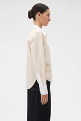 Profile view of model wearing the Oroton Crisp Poplin Shirt in Nougat/White and 100% cotton fabric for Women .