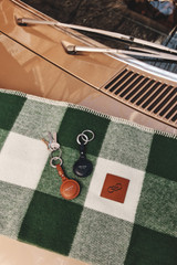 Detail product shot of the Oroton Larsen Air Tag Keychain in NIGHT SKY and Premium pebble leather for Men .