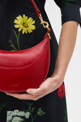 Profile view of model wearing the Oroton Florence Small Shoulder Bag in LAVA and Premium crackle leather for Women .
