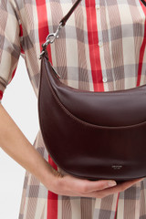Profile view of model wearing the Oroton Florence Medium Hobo in COPPER and Premium crackle leather for Women .