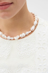 Profile view of model wearing the Oroton Marleigh Necklace in Worn Gold/White and Baroque & irregular freshwater pearl for Women .