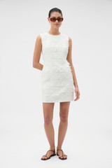 Profile view of model wearing the Oroton Broderie Trim Shift Dress in SOFT CREAM and 100% heavyweight linen fabric for Women .
