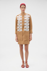 Profile view of model wearing the Oroton Broderie Trim Dress in CAMEL and 100% heavyweight linen fabric for Women .