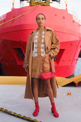 Profile view of model wearing the Oroton Broderie Trim Dress in CAMEL and 100% heavyweight linen fabric for Women